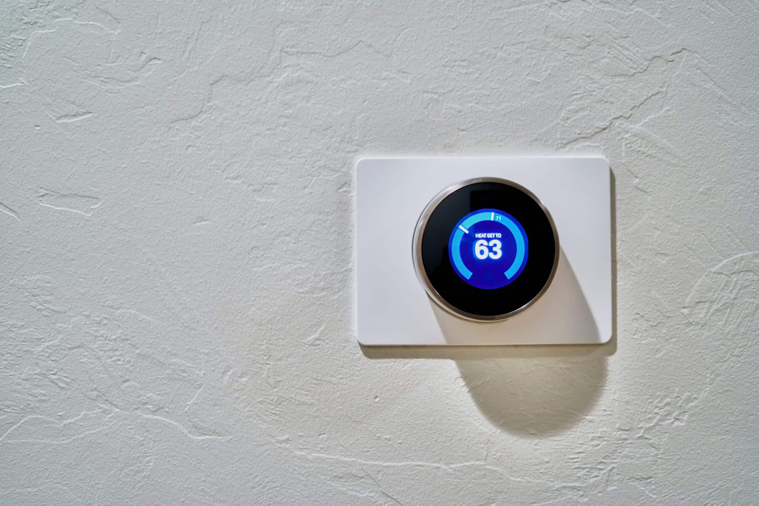 Photo of a Nest Thermostat on a home wall